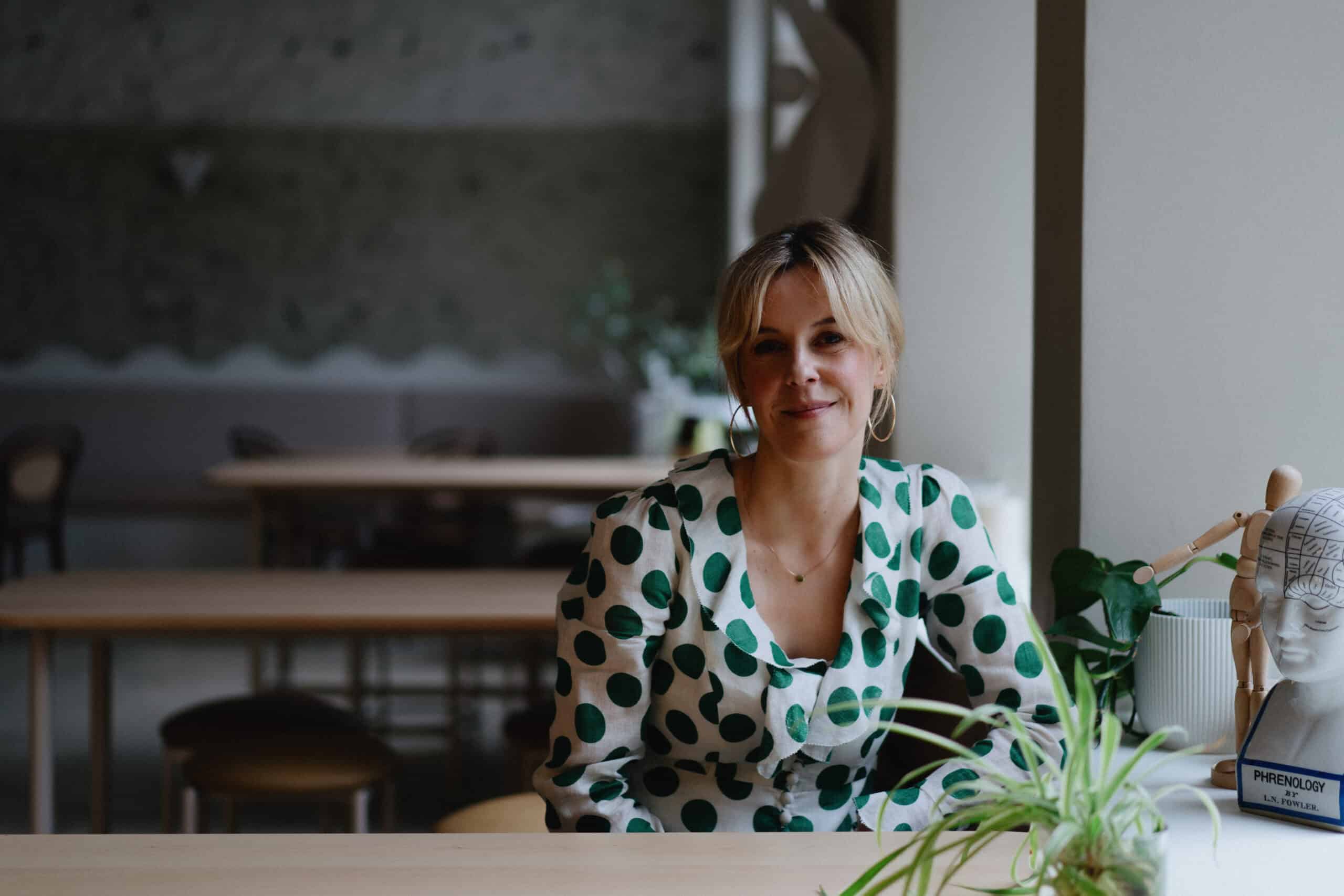 Annemarie Menne, clinical psychologist, seated at a table ready for a supervision session